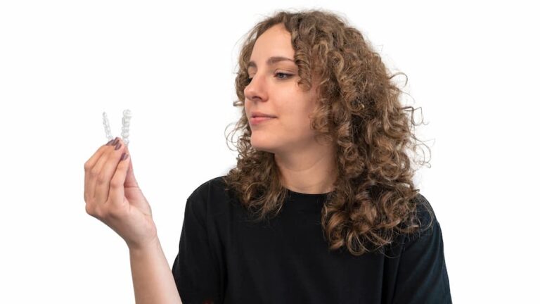 adult woman hold transparent braces for dental cor 2022 10 05 17 32 21 utc 1